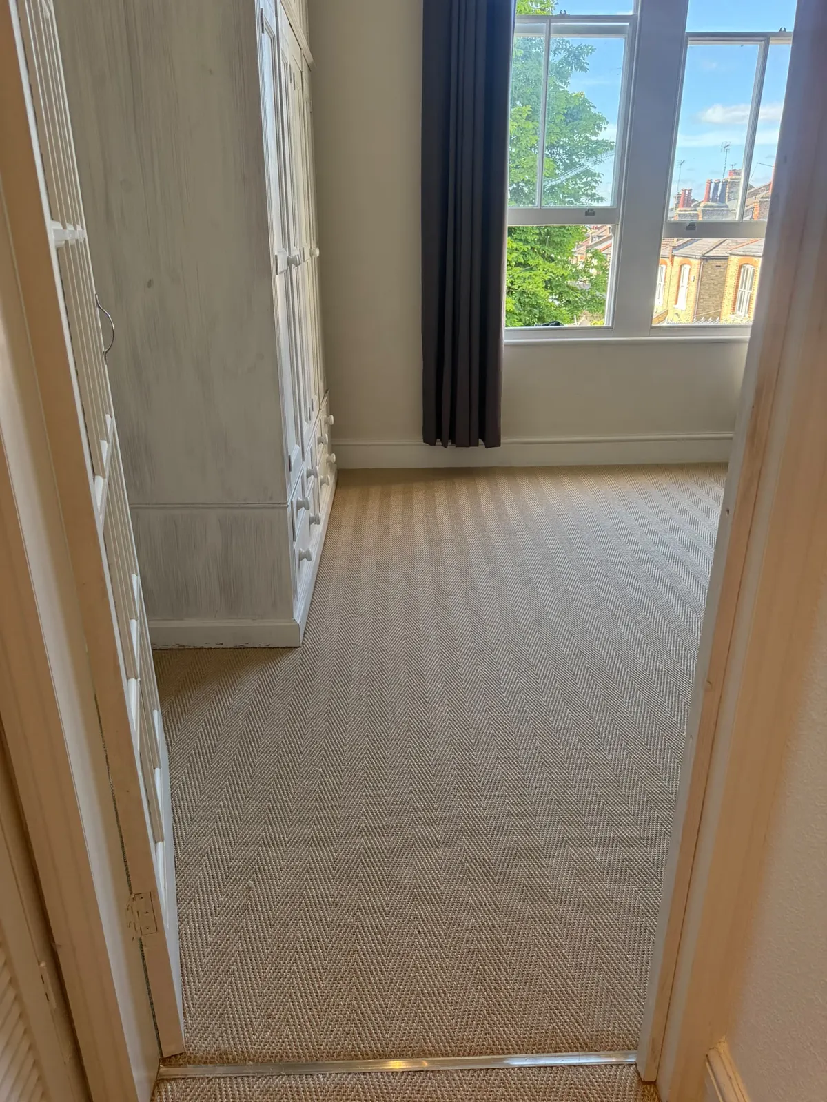 Herringbone sisal fitted in a bedroom