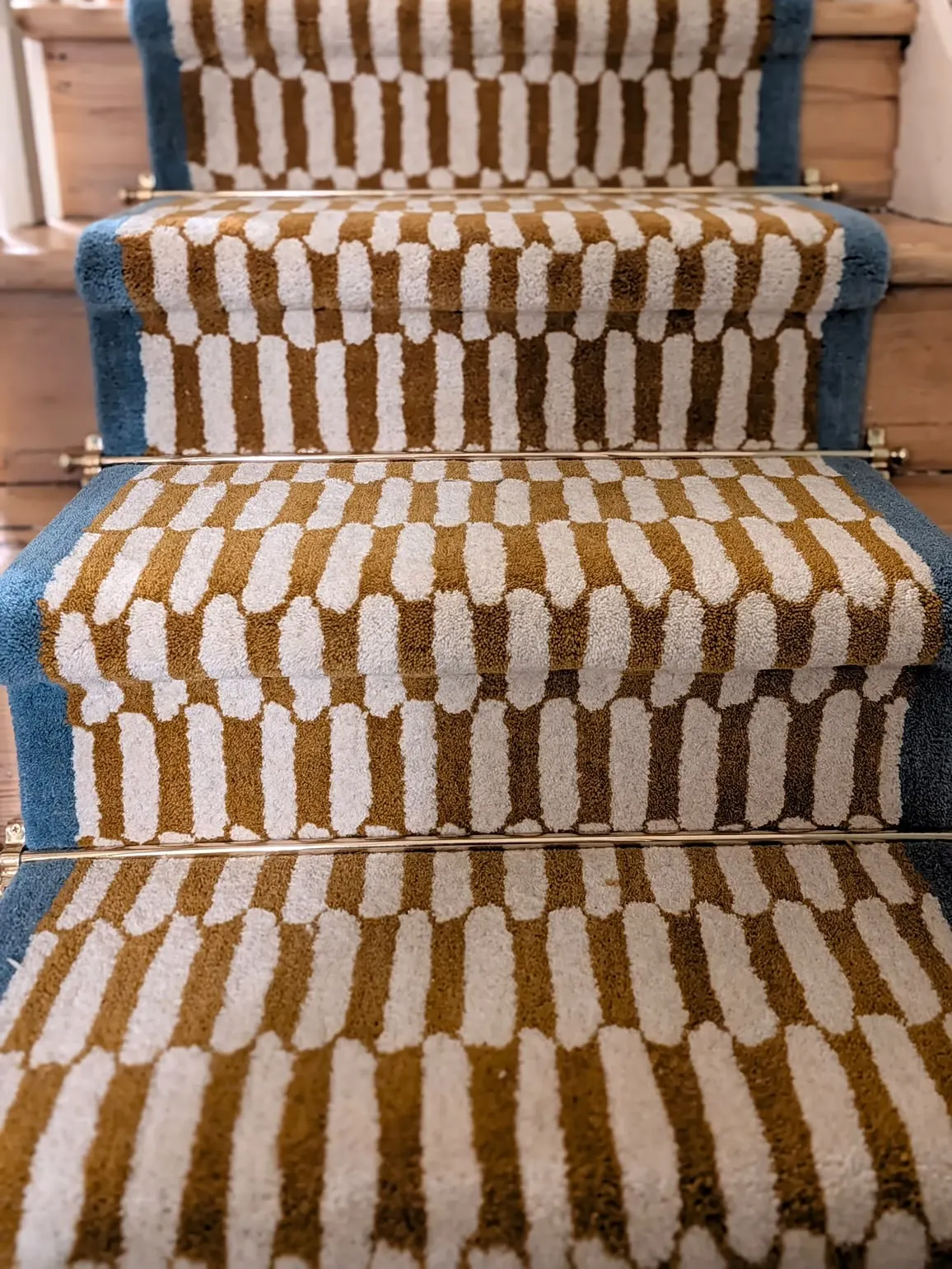 Mustard and cream patterned stair runner with blue border