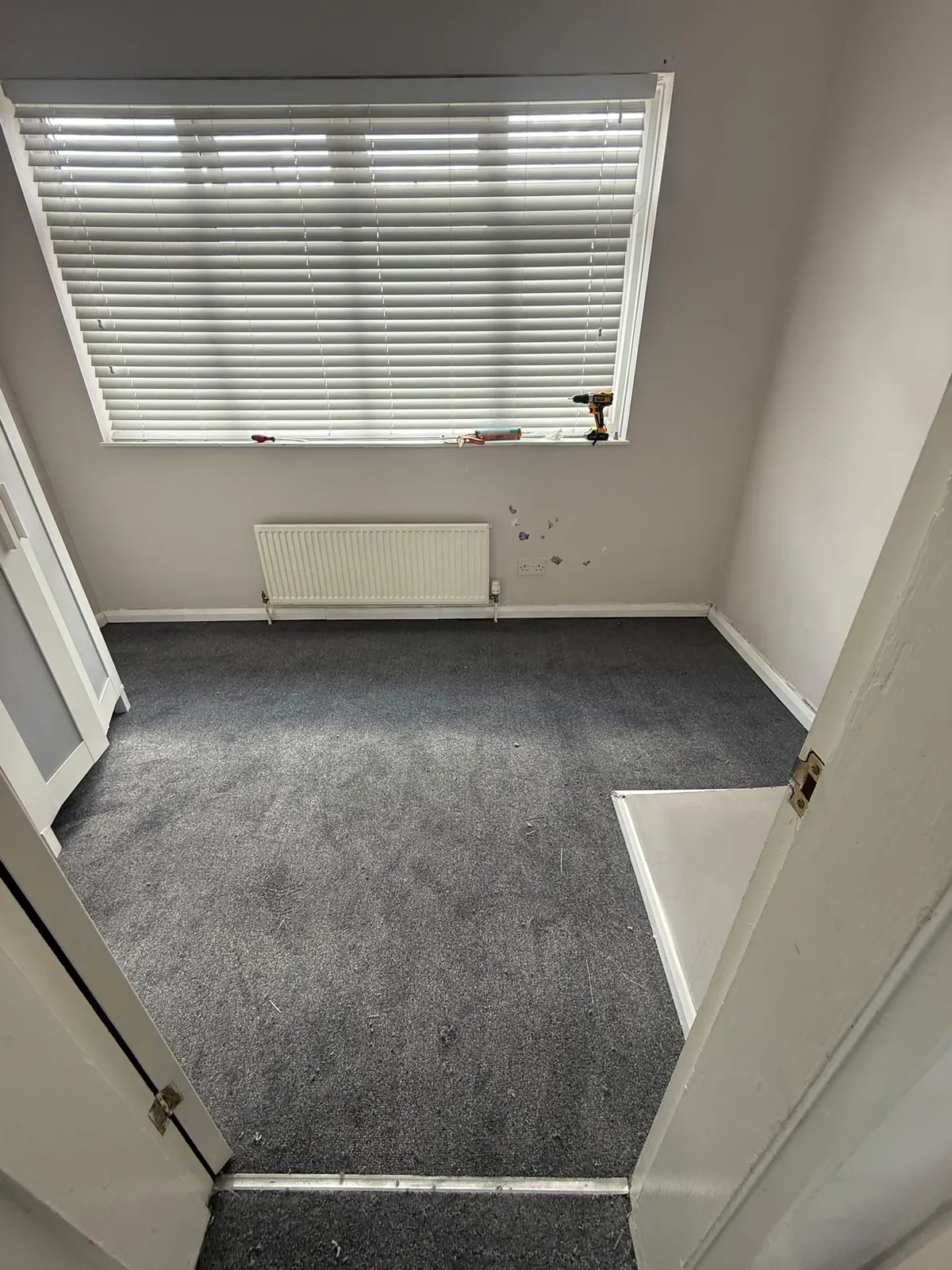 Grey carpet fitted in a bedroom