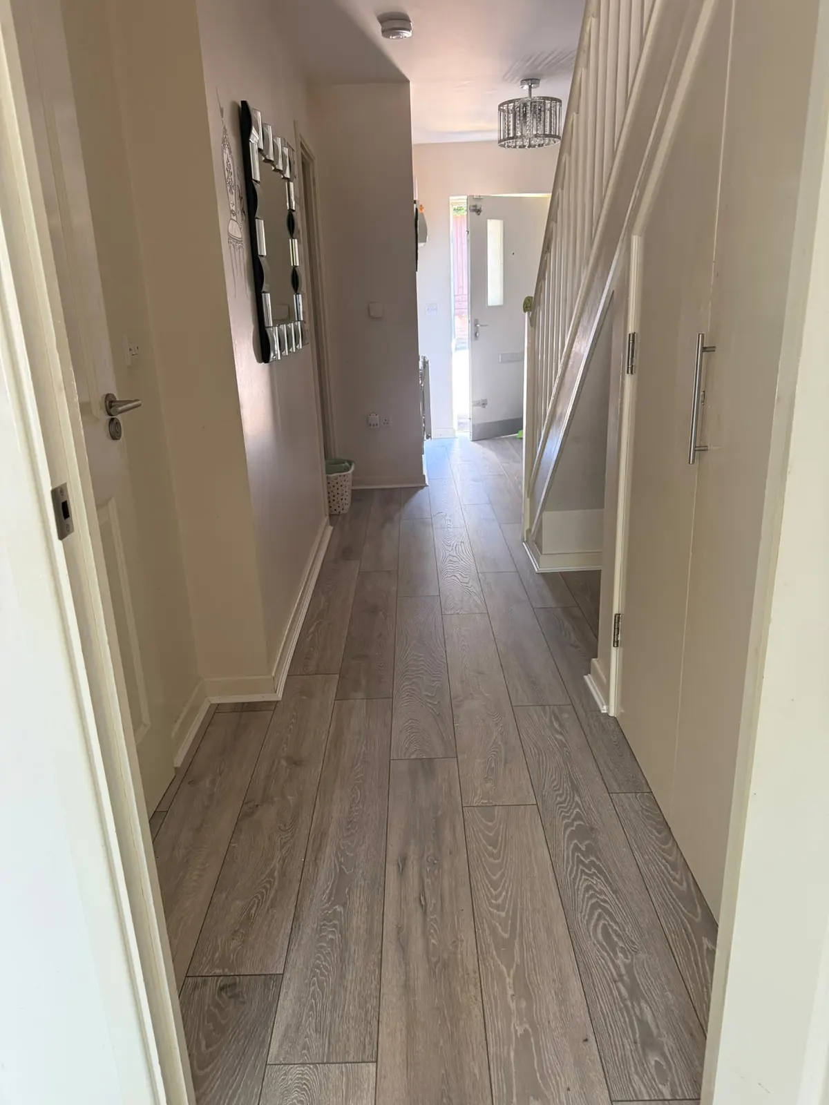Grey oak laminate fitted along a hallway