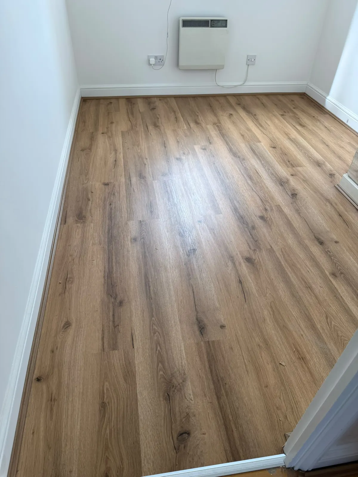 Oak laminate fitted in a small bedroom