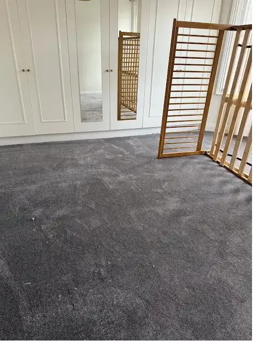 Dark grey bedroom carpet fitted with built-in wardrobes