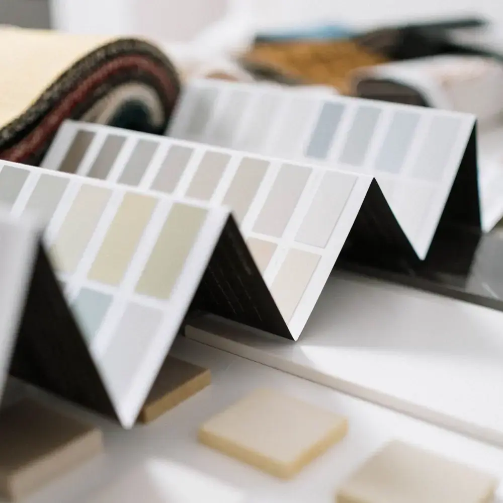 Colour samples and swatches laid out for a home visit