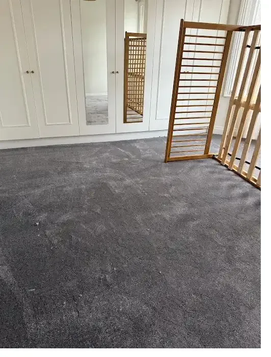 Dark grey bedroom carpet fitted with built-in wardrobes