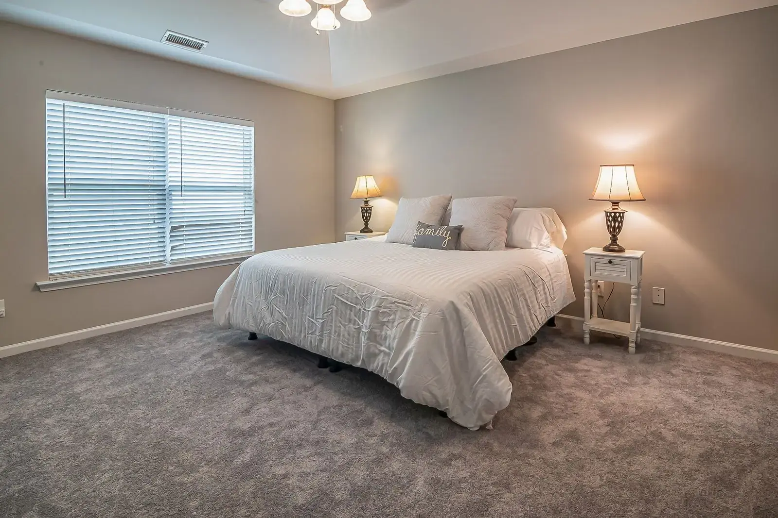 Grey carpet in a calm bedroom