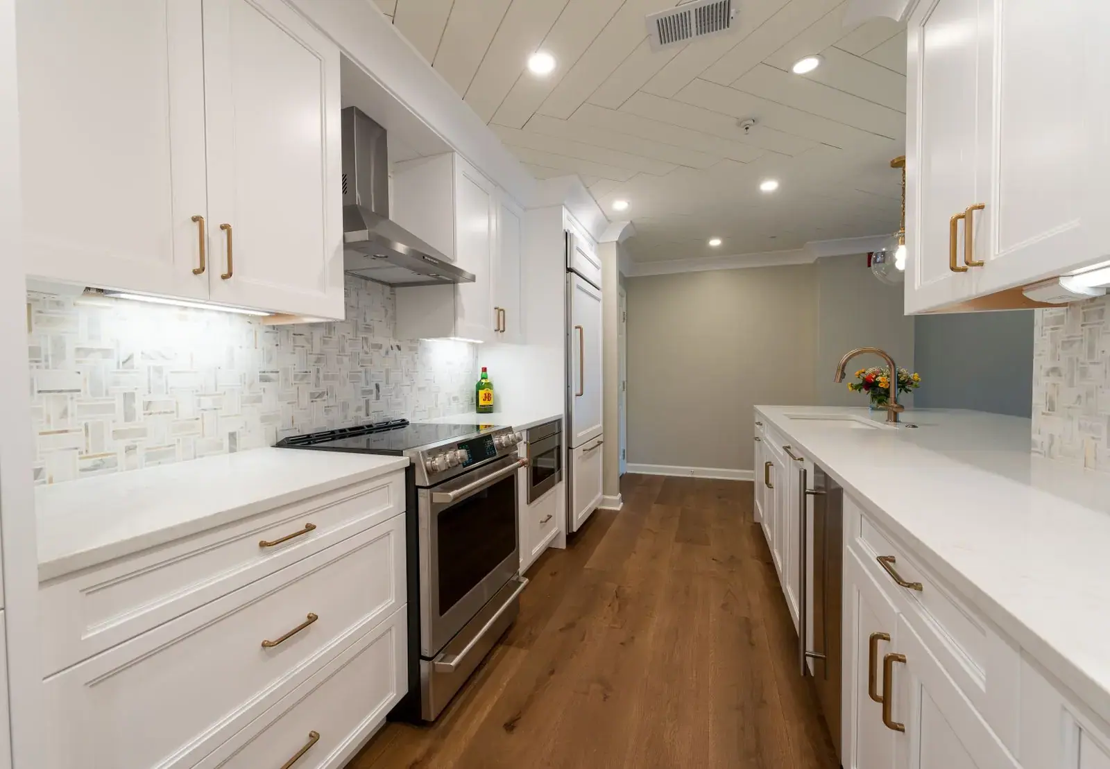 Wood-effect floor in a white kitchen
