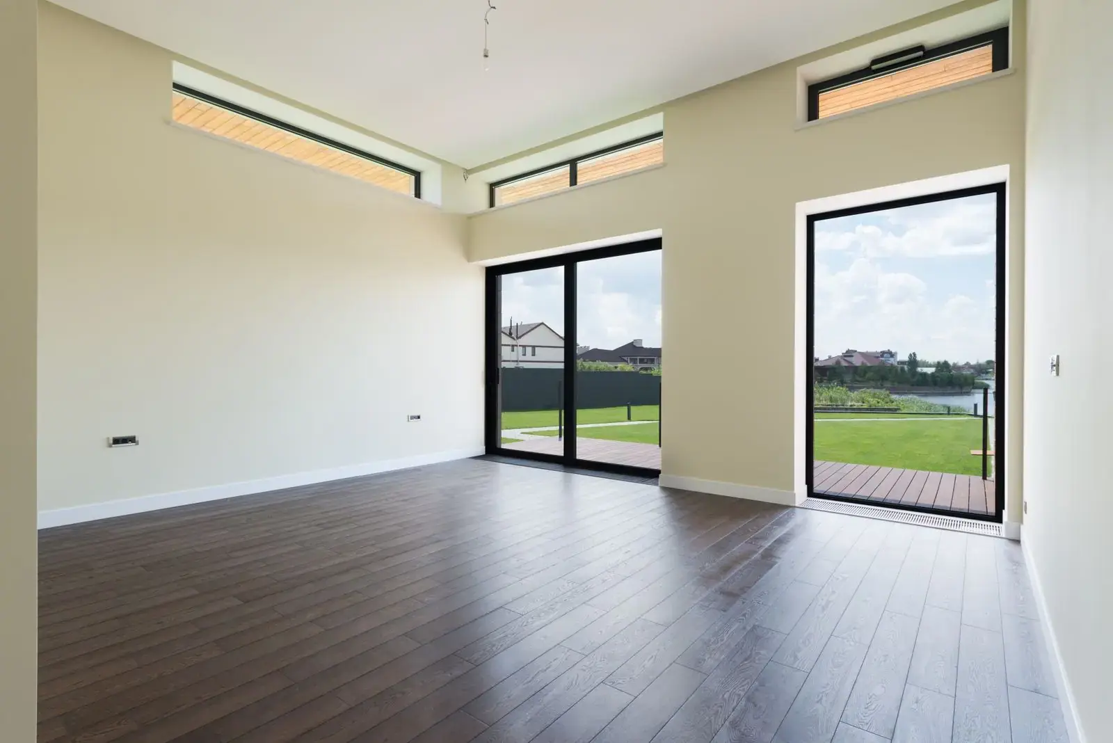 Dark oak-effect laminate in a bright, empty room