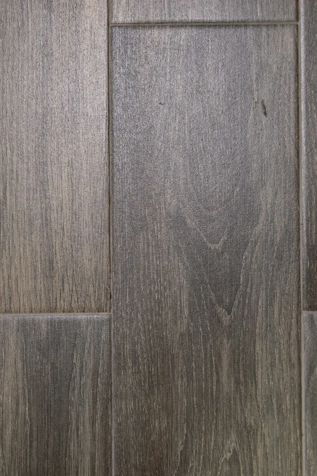 Close-up of herringbone wood-effect flooring