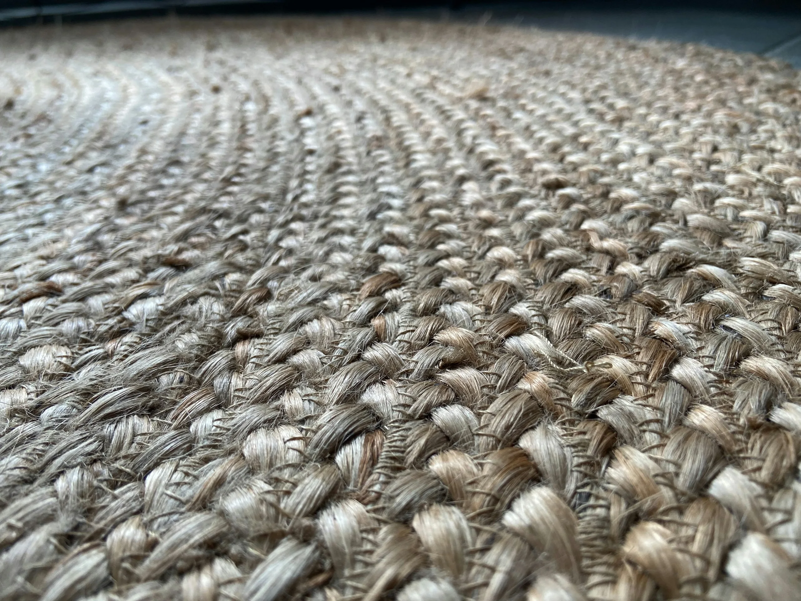 Rolls of neutral carpet stacked side by side